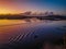 Soft and subtle sunrise waterscape with ripples from boat on the water