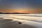 Soft Summer Sunrise Seascape with Seaweed on the Beach