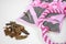 Soft textile washable snuffle rug with hiding treats in pockets for dogs nose work and pink fabric tug-of-war toy for
