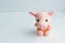 Soft toy pig on a light background