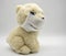 Soft toy a white teddy bear in a medical fabric mask on a light background