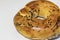 Soft Turkish bagel acma with olives and black seeds on white background.