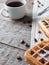 Soft Viennese Belgian waffles with powdered sugar and coffee beans on rustic wooden background Copy space