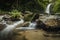 soft water of the stream in the natural park, Beautiful waterfall in rain forest