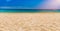 Soft wave of blue ocean on sandy tropical beach. Background of tropical paradise beach with golden sand, travel tourism panorama