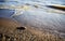 Soft wave of the sea on the sandy beach. pure transparent waves beat on the sandy shore