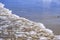 Soft wave of the sea on the sandy beach. Soft waves with foam of ocean on the sandy beach background