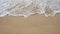 Soft white wave of the sea on the sandy beach at Phuket, Thailand. Copy space for some text