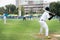 Softball pitcher throwing the curve ball to the batter.