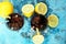 Softdrink with ice cubes, lemon and straw in glass.