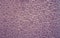 Soften vintage purple pebble textured background