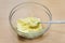 Softened butter in a glass dish, cooking home-made cake