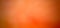 A softly blurred orange textured bokeh abstraction for the background.