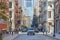 Soho street with cast iron buildings and people in New York