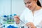 soil analysis for harmful chemicals in an agronomy laboratory young woman takes soil prose from a test tube for chemical analysis