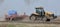 Soil is being prepared on the farmer`s field for sowing of agricultural crops with the simultaneous application of mineral