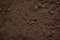 Soil close-up background, texture and structure of the earth, top view, brown humus rich in trace elements for planting