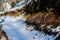 The soil crumbles as a result of freezing. A small erosion of land going on snow