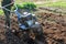 Soil cultivation. The cultivator loosens the ground