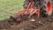 Soil earth and tractor fertilizing field. Heavy agricultural machinery