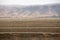 soil fields and irrigation pipes in farmland in Gilroy California