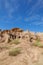 Soil mountain under clear sky