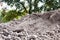 Soil pile, dirt hill for agriculture and construction building site, soil mound dirt white