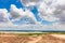 Soil prepare for building under blue sky and cloud