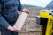 Soil Sampling. An engineer employee of a research laboratory packs a soil sample in a paper package. Automated probe for soil