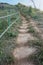 Soil stair with green metal fence