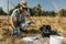 Soil Thermometer. Female Agronomist Measuring Soil Temperature