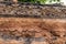 Soil under the road, which has been eroded in the countryside.