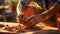 Soiled hand shaping clay in an outdoor workshop