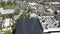 Solar building rooftop aerial view descending, Long Beach overlooking traffic and roads