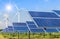 Solar cells and wind turbines generating electricity in power station alternative renewable energy