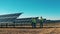 Solar energy specialists walking and talking at a solar power facility