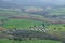 Solar farm amidst green fields and orchards