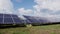 Solar farm on green field. Alternative energy.