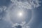 Solar, halo or sun dog, or parhelion interesting atmospheric optical phenomenon in the blue sky