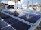 Solar panel detail of boat in marina in the French West Indies. Solar charging battery aboard a yacht. Close up of plate for