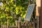 Solar panel in the garden, providing three led-lights with energy