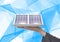 solar panel on hand technological blue and white background