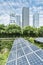 Solar Panel Photovoltaic installation with urban landscape landmarks, alternative electricity source