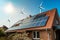 Solar panel on a roof of a house and wind turbins arround