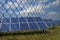 Solar panels behind rusty fence