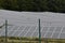 Solar panels close up placed on a meadow in dense rows, in Zarnovica, district town in Slovakia, Europe.