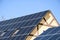 Solar panels, Close up shot of a solar panel array with blue sky, Solar panels on a roof for electric power generation