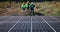 Solar panels, engineering people and farm teamwork or renewable energy solution, electricity or eco friendly power