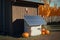 Solar panels, garden shed. Autumn season, pumpkins. AI generative, illustration generated by AI