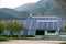 Solar panels, photovoltaics over the roof of an industrial building - alternative electricity source.